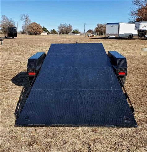 D JACK, 14' DECK, 2' DOVETAIL WSLIDE IN RAMPS, 82" WIDE BETWEEN FENDERS, D-RINGS, DIAMOND PLATED FLOOR AND FENDERS, 5-LUG 3500LB AXLES, ELECTRIC BRAKES ON REAR AXLE ONLY, 7,000 GVWR (TH). . Texoma trailers